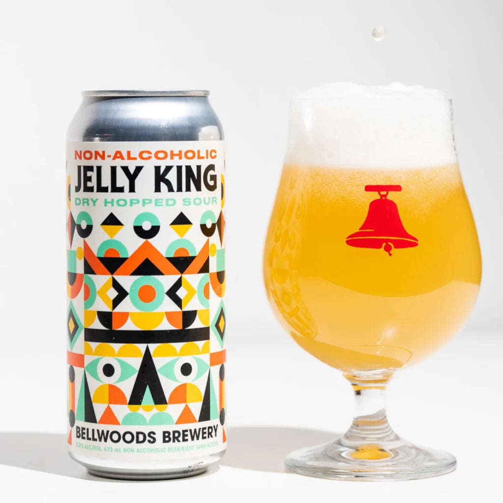 Non-alcoholic beer can and glass with Bellwoods Brewery logo on a white background