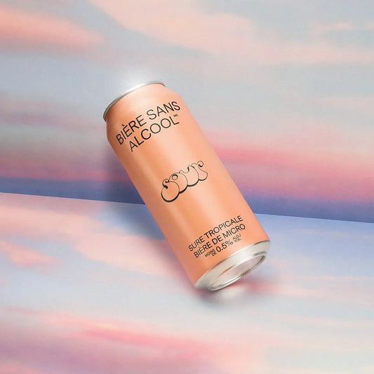 Alcohol-free beer can with branding on a colorful background