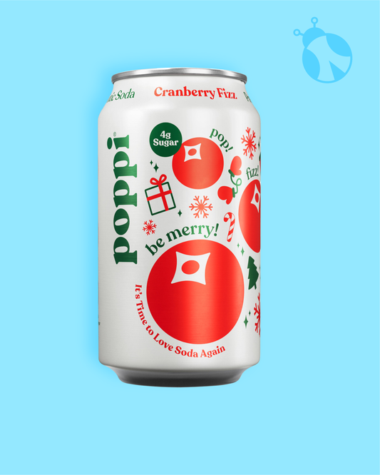 Poppi Cranberry Fizz soda can on a blue background